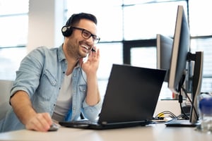 man_with_headset_in_office